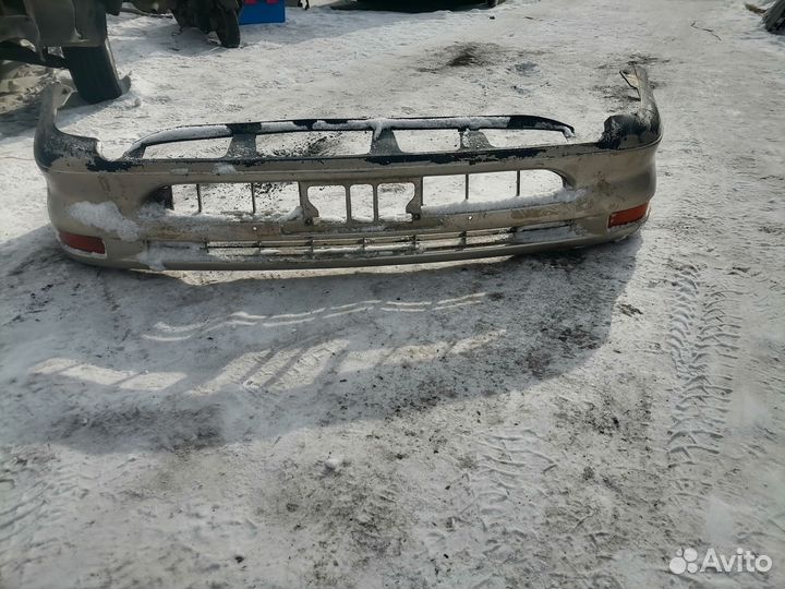 Передний бампер Toyota Corolla 100