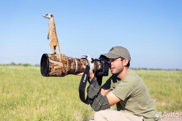 Фотограф с животными,работник в зоопарк