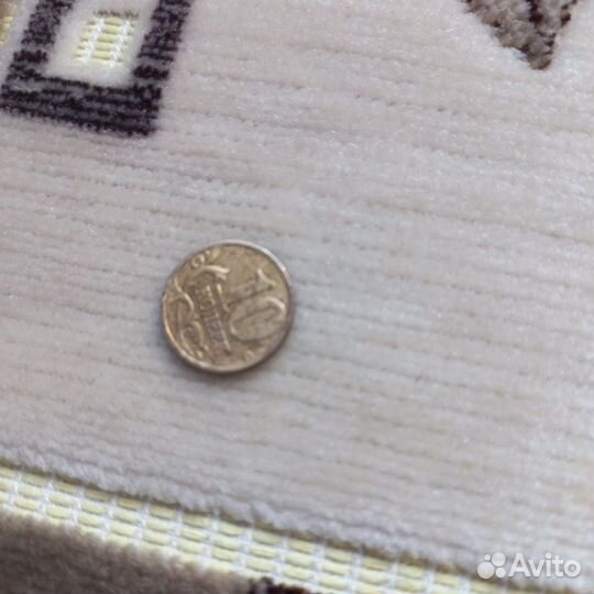 Монета 10 копеек 2002 года заводской брак