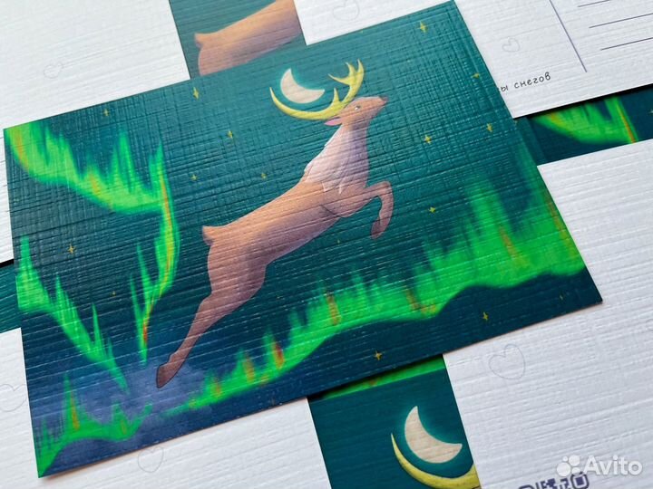 Почтовая открытка с оленем и северным сиянием