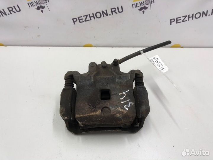 Суппорт тормозной передний левый Nissan Juke