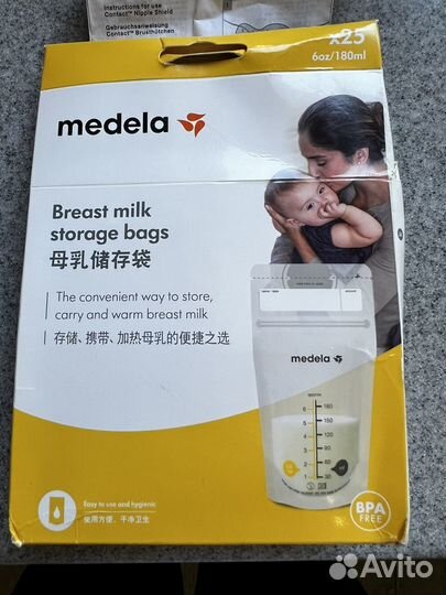 Молокоотсос medela ручной и пакеты в подарок