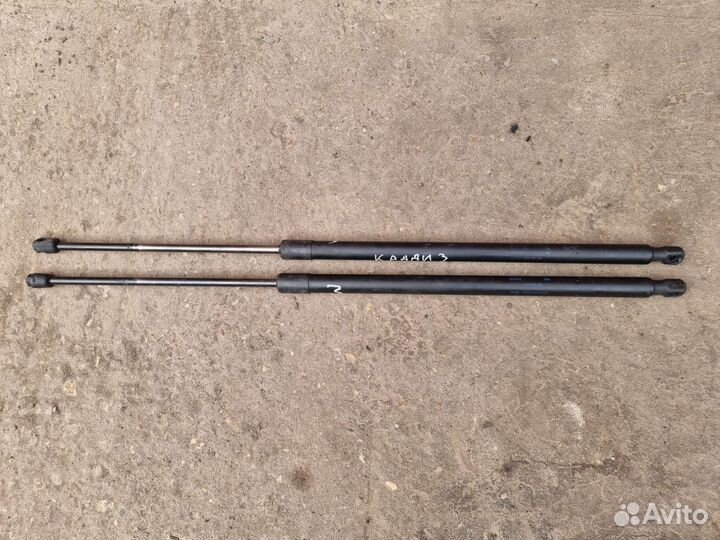 Амортизатор крышки багажника Кадди 3