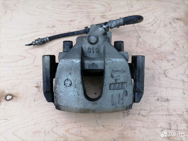 Передний тормозной суппорт Мазда 3