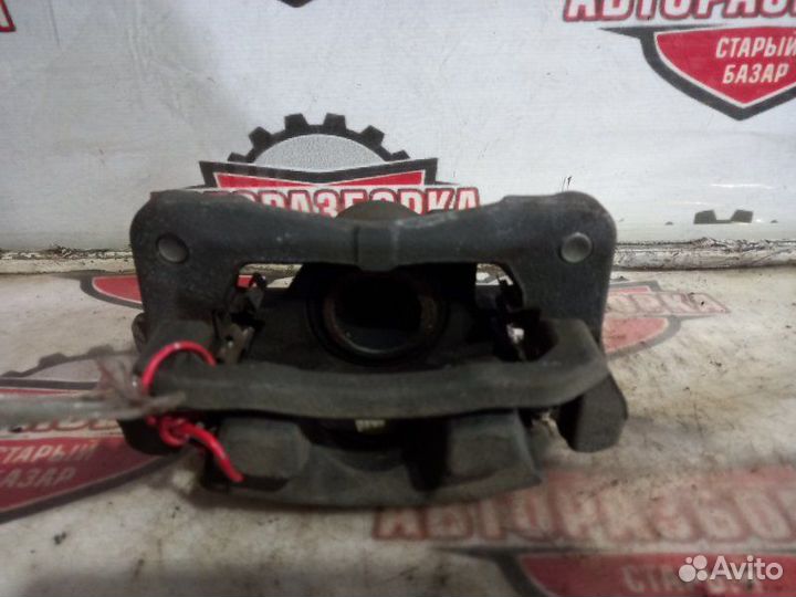 Суппорт тормозной задний левый Toyota Alphard