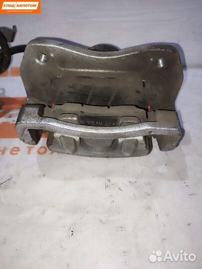 Суппорт тормозной передний левый Kia Sportage 4