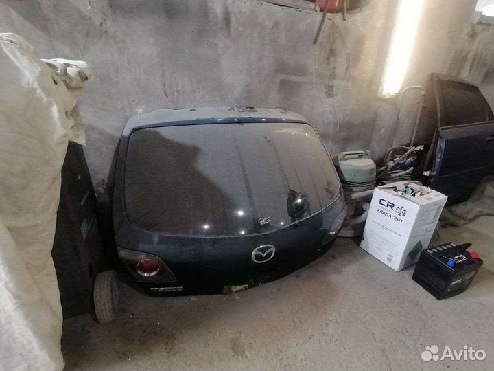 Заднее стекло на крышку багажника mazda 3
