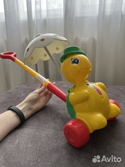 Игрушка каталка с ручкой