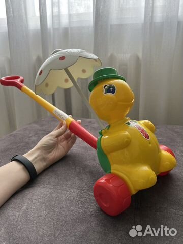 Игрушка каталка с ручкой