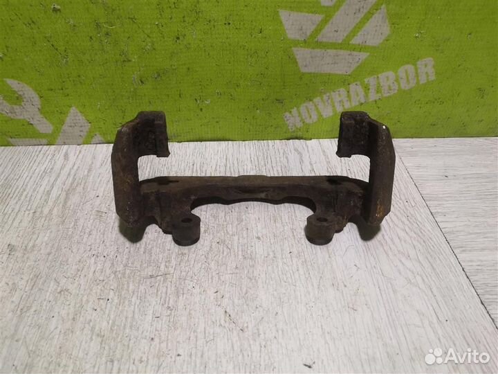 Скоба суппорта переднего Киа Сепия Шума 96-01