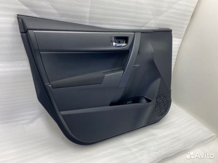 Обшивка двери передняя левая Toyota Corolla