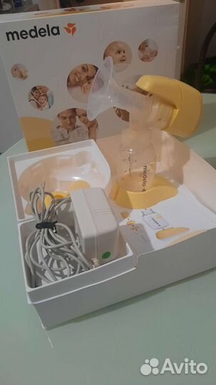 Молокоотсос medela электрический