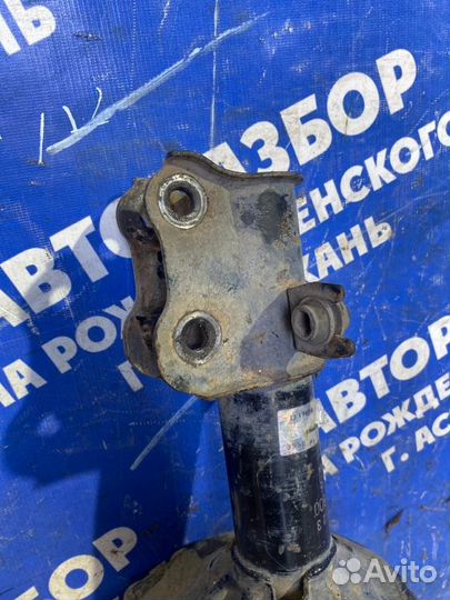 Передняя левая стойка амортизатора Kia Clarus