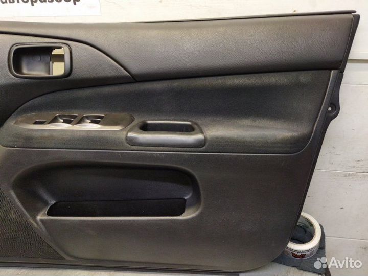 Обшивка двери передняя правая Mitsubishi Lancer 9