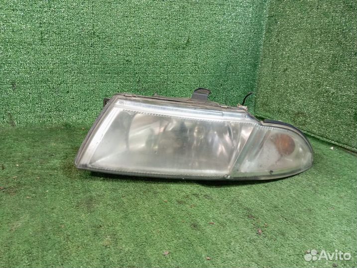Фара левая Mitsubishi Carisma