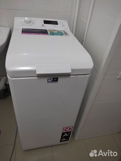 Стиральная машинка с вертикальной загрузкой