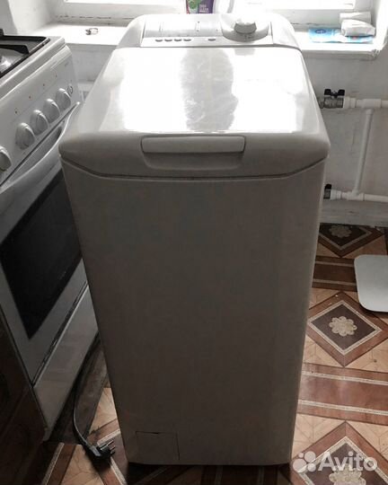 C вертикальной загрузкой Candy CTY 1035 Italy