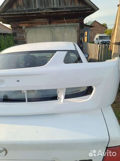 Передний бампер mazda 323