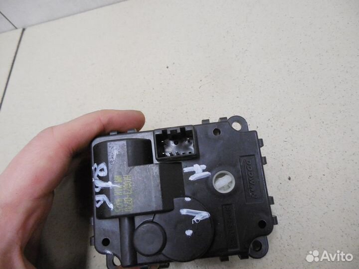 Моторчик заслонки отопителя Mohave 2009