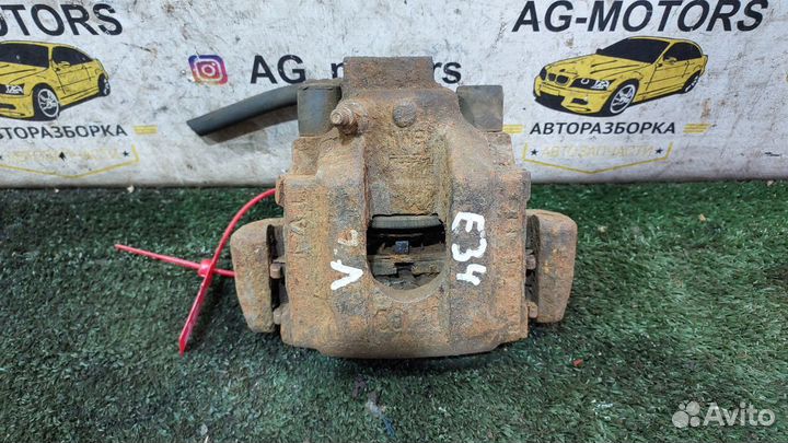 Суппорт тормозной задний левый BMW E34