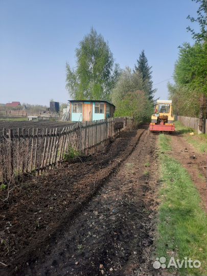 Вспашка земли трактором фреза,плуг