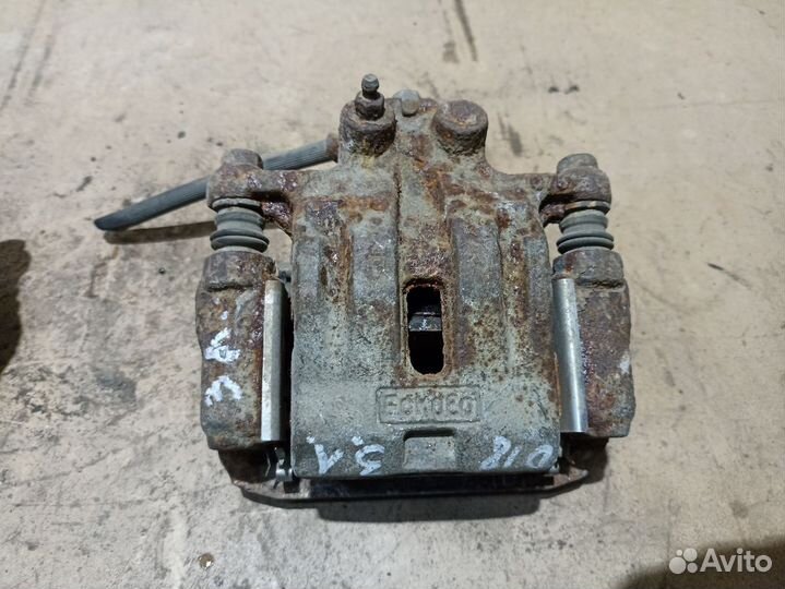 Суппорт тормозной задний Mazda CX-7 I рестайлинг