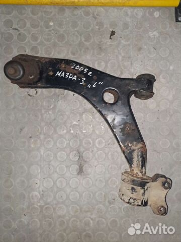 Мазда 3 Рычаг передний левый