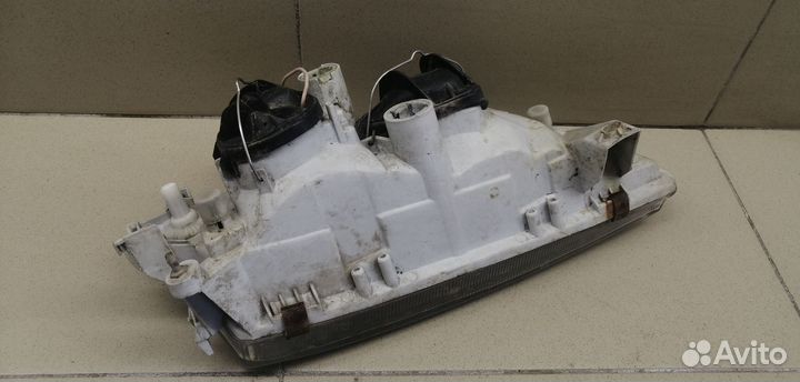 Фара левая Primera P11E 1996-2002