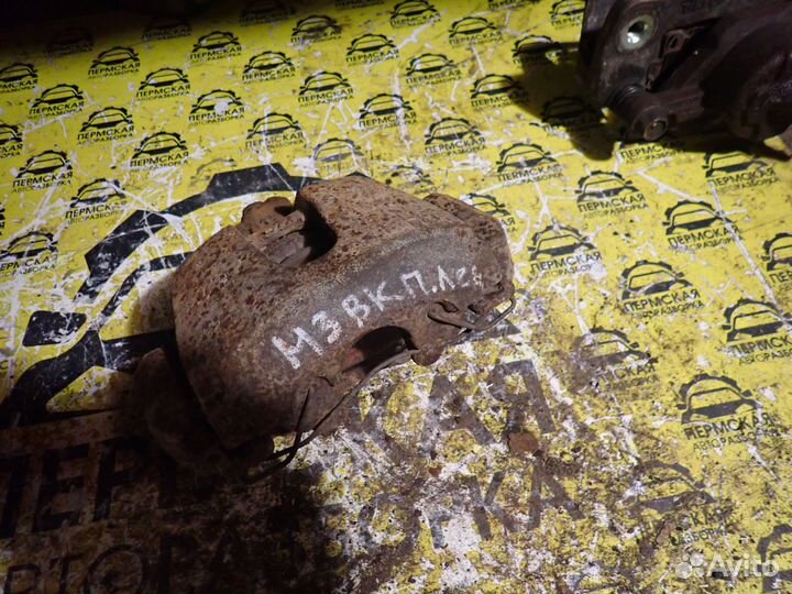 Суппорт тормозной передний левый Mazda 3 BK