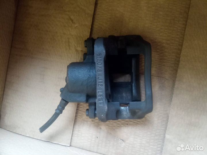 Суппорт тормозной передний левый Renault Logan