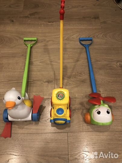 Игрушка каталка с ручкой