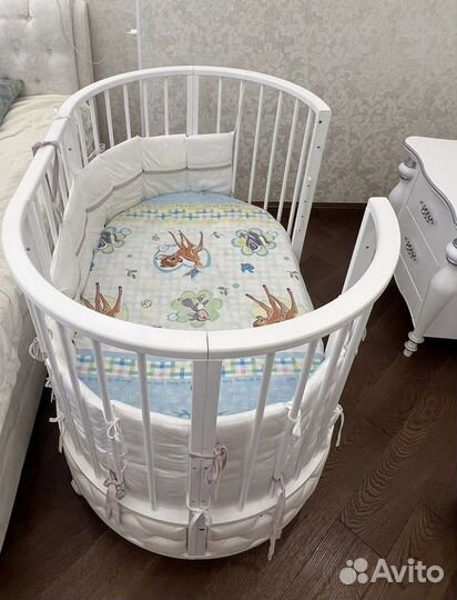 Детская овальная кроватка с маятником