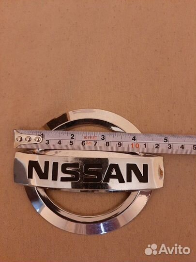 Эмблема Nissan