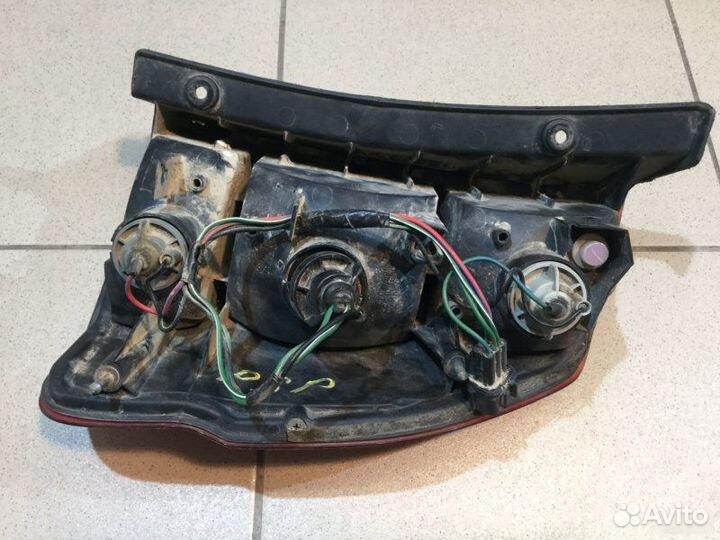 Фонарь левый Mitsubishi Pajero K9 1997-2008