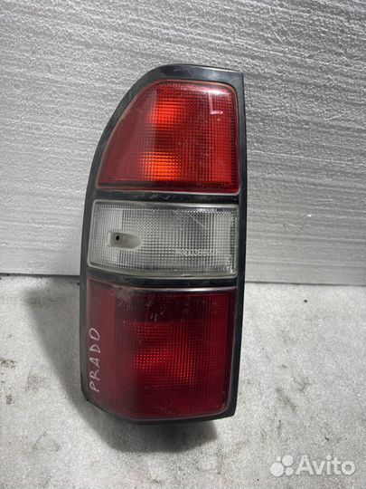 Фонарь заднего хода левый Toyota Land Cruiser 90 P