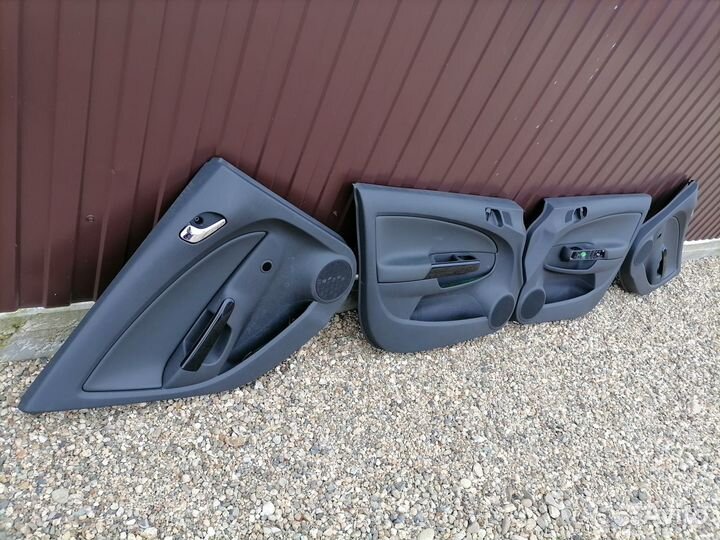 Opel Corsa D обшивки дверей