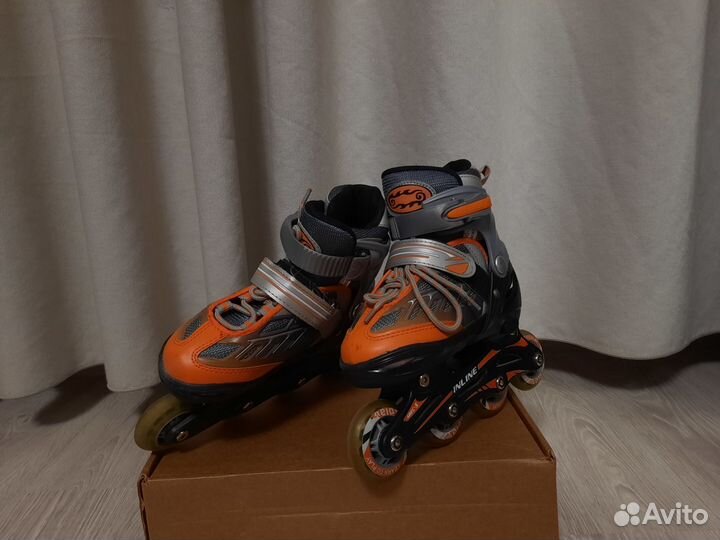 Роликовые коньки