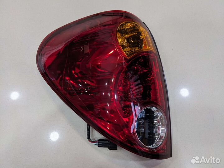 Фонарь задний левый mitsubishi L200 2006-2014
