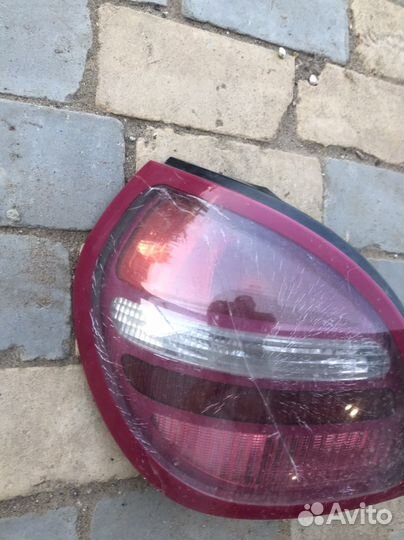 Задний левый фонарь Ниссан Альмера н16 хэтчбек
