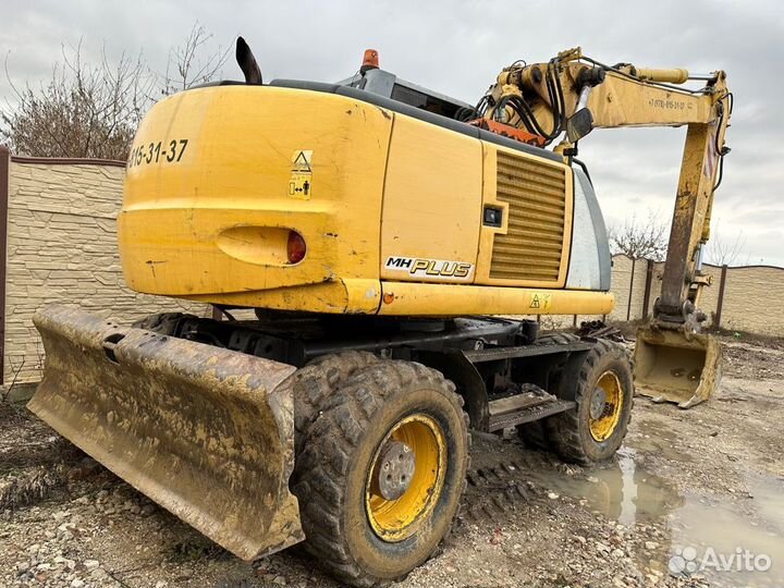 Колёсный экскаватор New Holland MH Plus, 2005