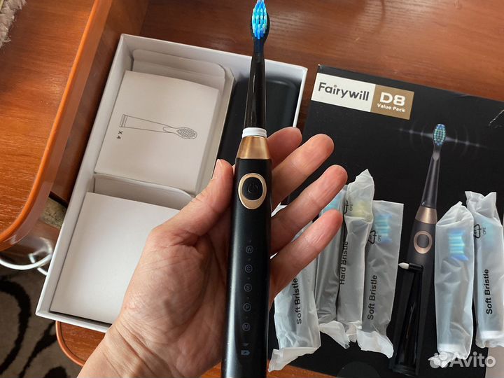 Электрическая зубная щетка