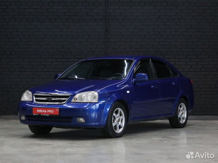 Авито уфа лачетти. Chevrolet Lacetti 2012 седан. Темно синий Lacetti. Синяя Лачетти в горах. Шевроле Лачетти синего цвета фото.