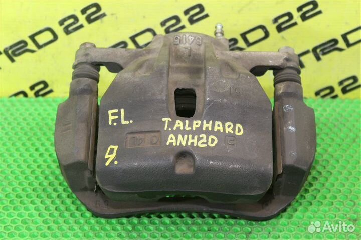 Суппорт тормозной передний левый Toyota Alphard