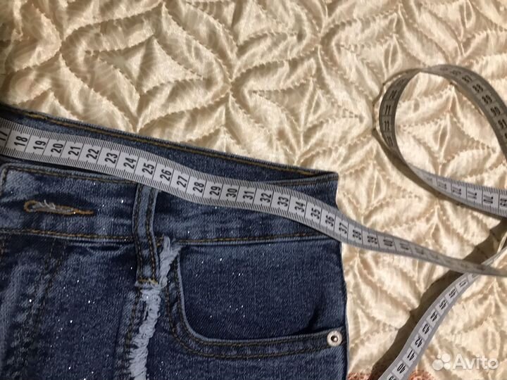 Джинсы клеш с бахромой