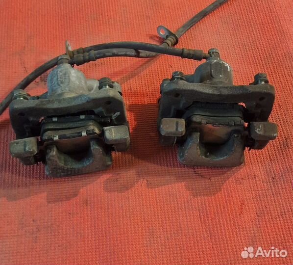 Суппорт тормозной задний пара Toyota Camry ACV40