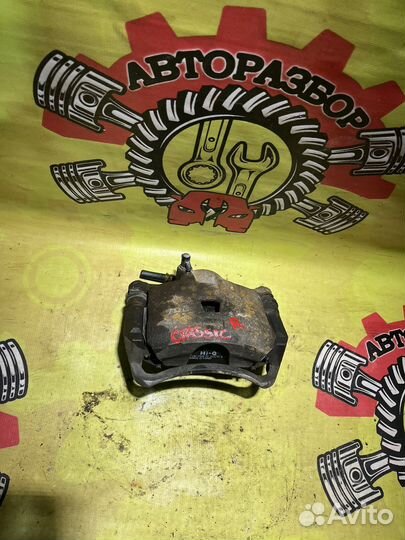 Суппорт передний правый Nissan Almera Classic B10