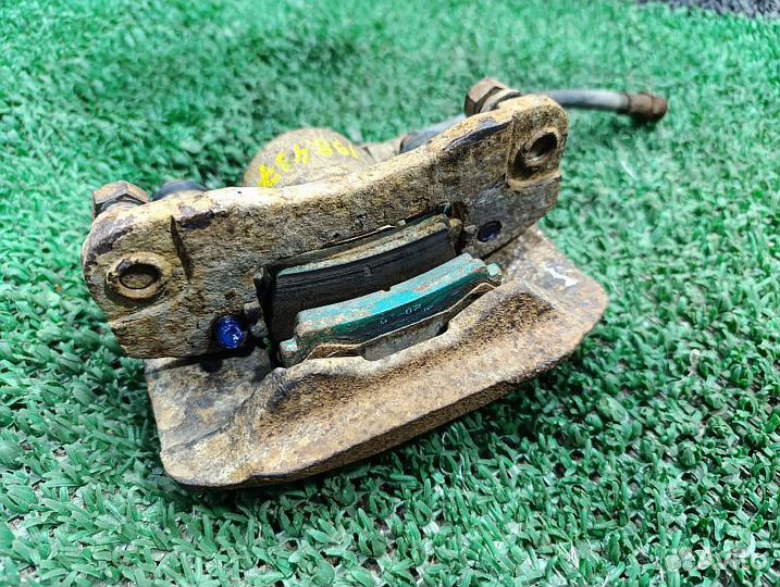 Суппорт тормозной задний левый Mitsubishi Pajero Sport