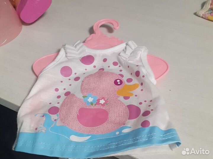 Куклас одеждой и с бутылочкой и горшком