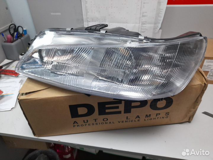 Фара левая Peugeot 306 97
