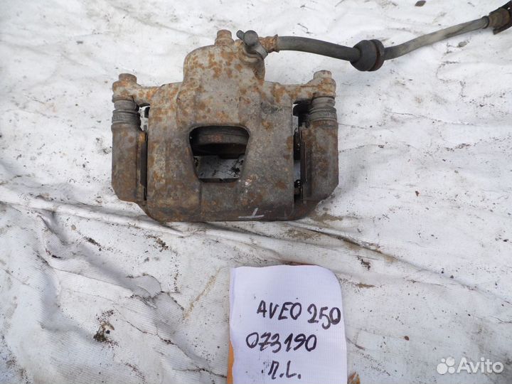 Суппорт тормозной передний левый Chevrolet Aveo (T